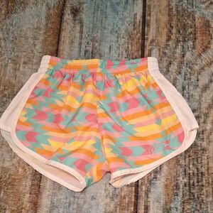Vibrant Pink and Orange Athletic Shorts with Geometric Design. Size XS